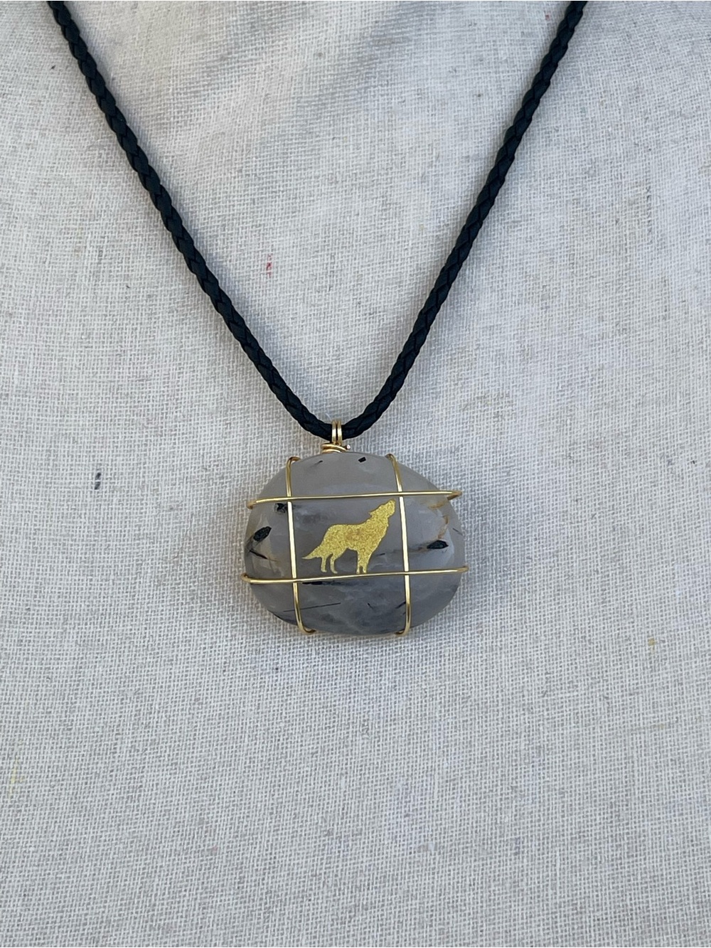 Tourmalinated Quartz Necklace with Wolf Gold Tone Accent on Black Braided Cord